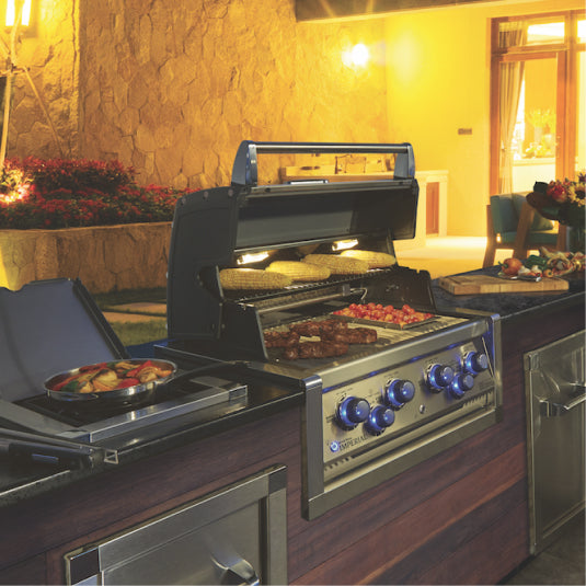 Broil King Imperial S 590 998083 Built-In Gas Barbecue, built into an outdoor kitchen at night