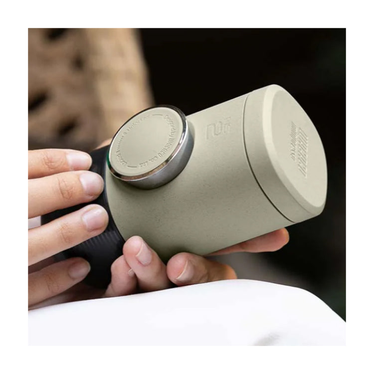 Wacaco Minipresso NS2 Portable Espresso Maker, held in the hand
