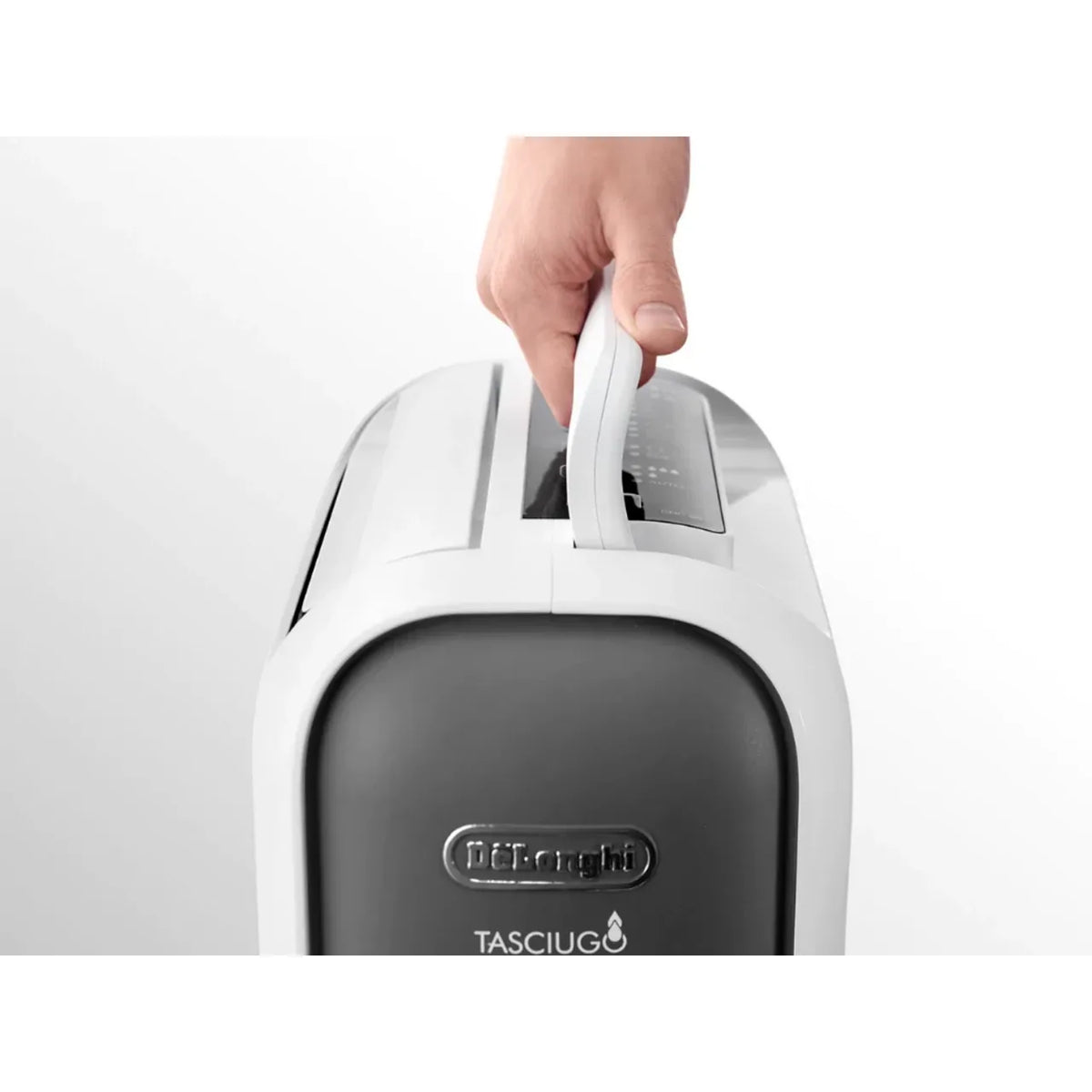 De'Longhi DNS65, hand lifting the unit by its carry handle