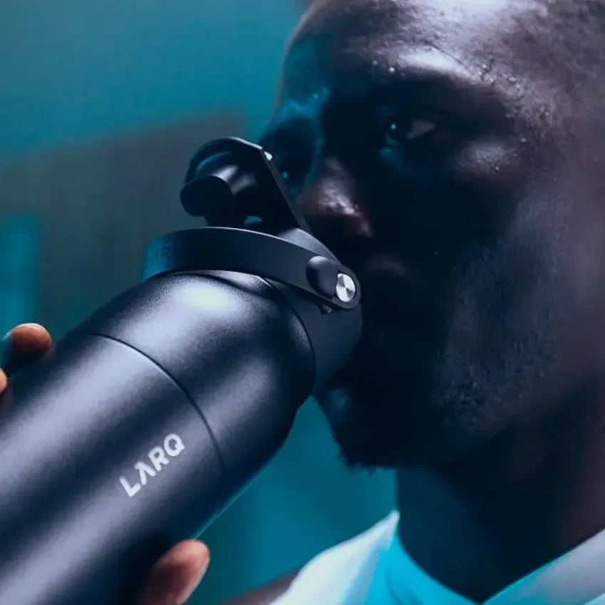 LARQ PureVis in Obsidian Black, person drinking from the bottle