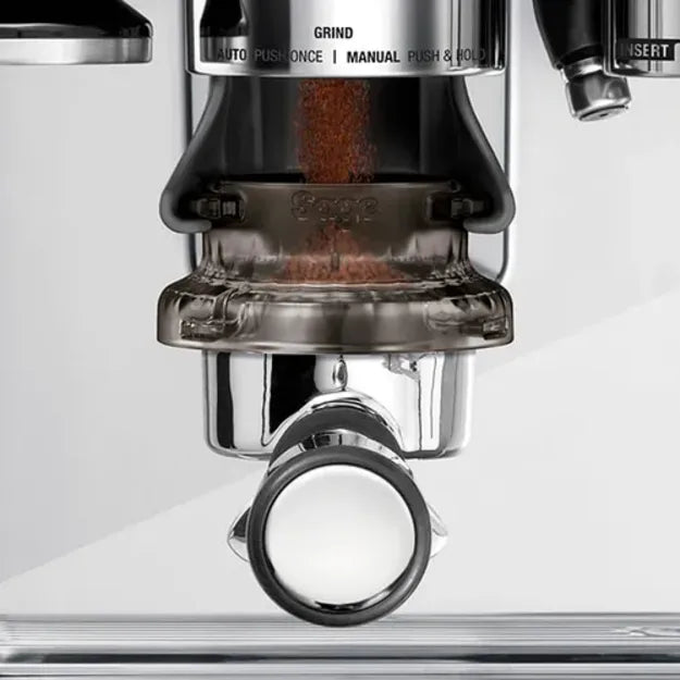 Sage SEA201NEU0ZEU1, in use on a grinder with coffee falling into the portafilter