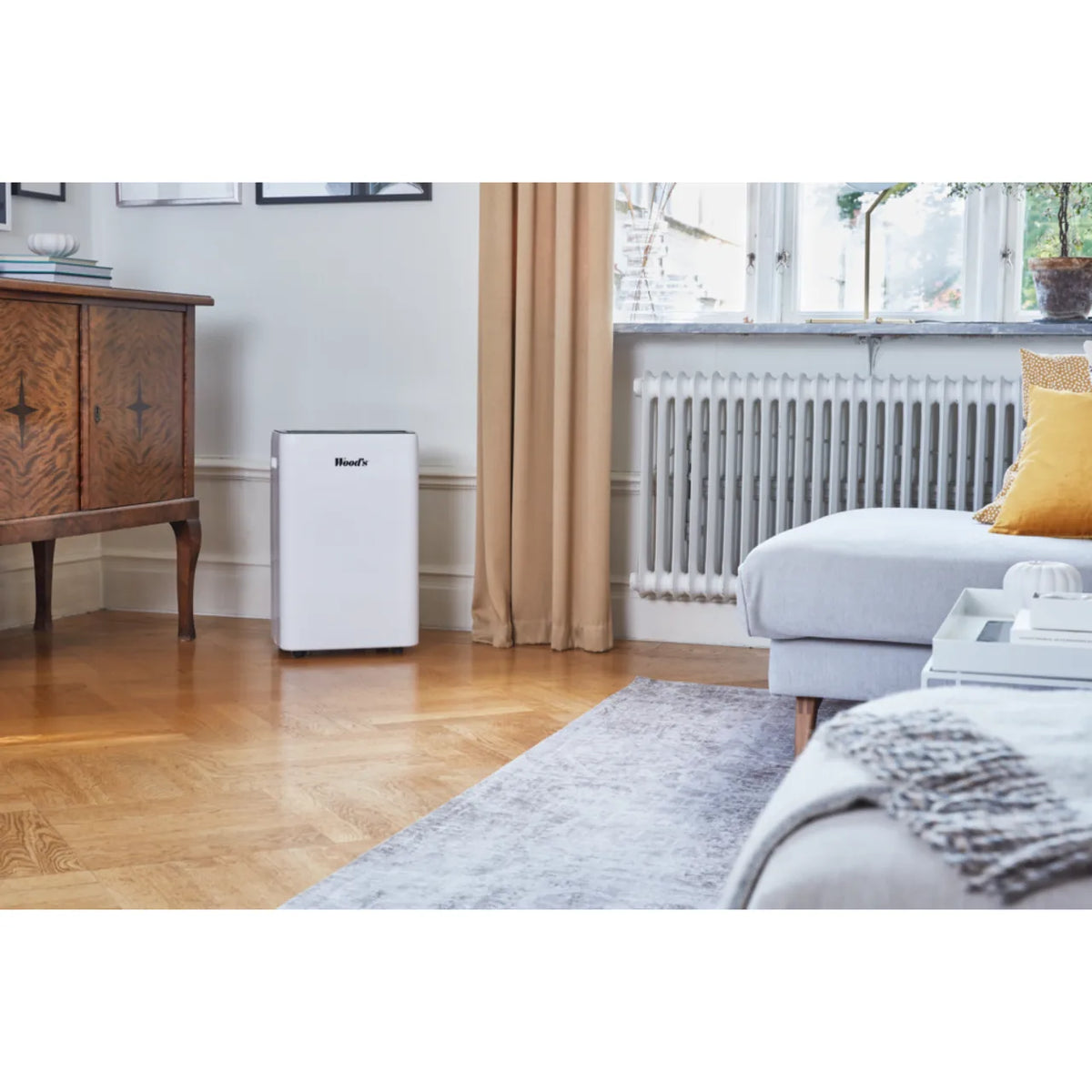 Wood's MRD20GW in White, in a living room beside a radiator and sofa