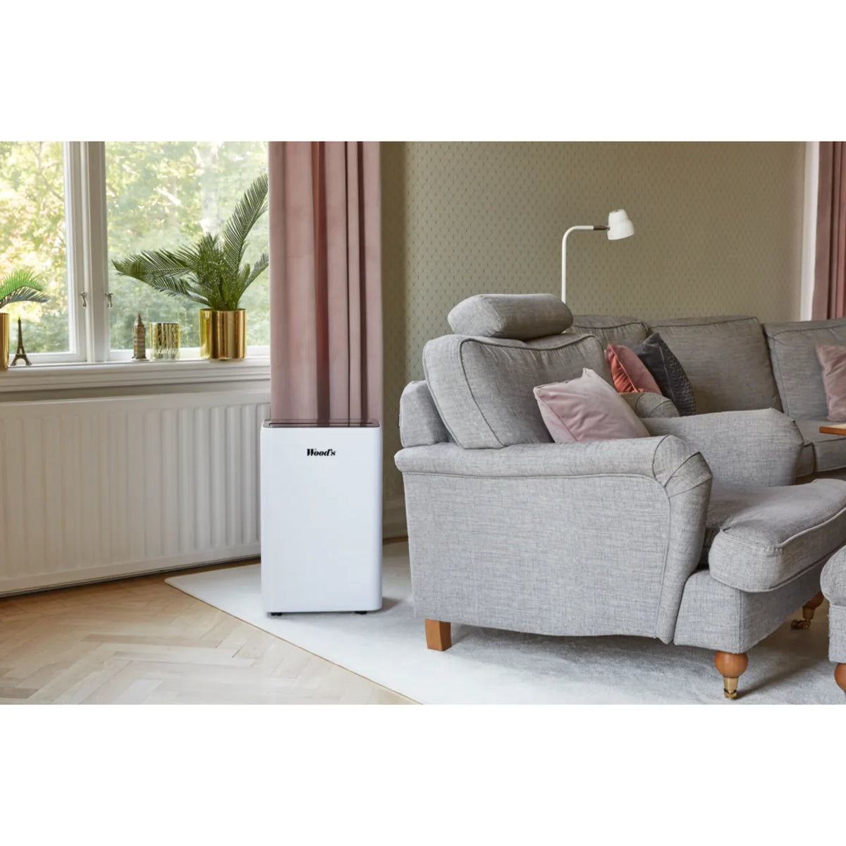 Wood's MRD20GW in White, close room view beside a radiator and grey armchair