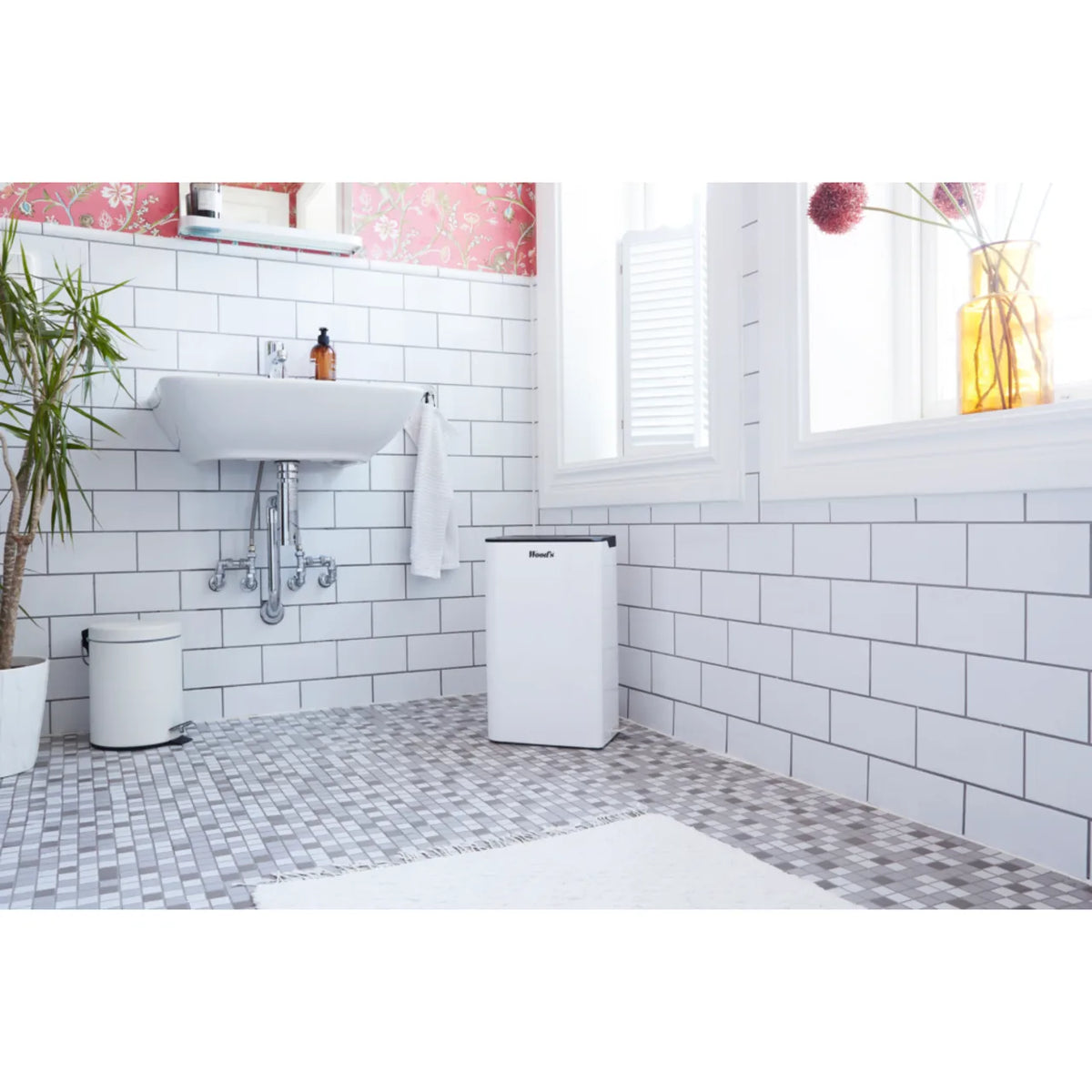 Wood's MRD20GW in White, in a tiled bathroom next to a washbasin