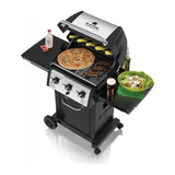 Broil King Monarch 320 834253 Gas Barbecue, lid open with food on the grill