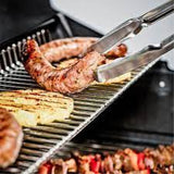 Broil King Baron 590 876283 Gas Barbecue, grilling sausages and vegetables