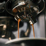 Sage Barista Touch SES880BSS Espresso Machine in Brushed Stainless Steel, close-up of espresso pouring