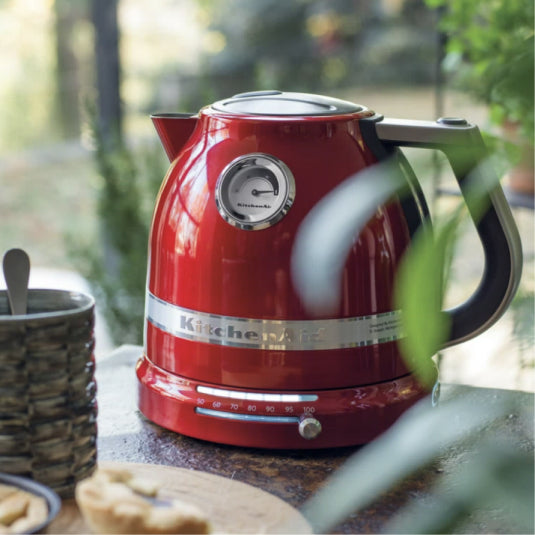 KitchenAid Artisan 5KEK1522 Electric Kettle in red, outdoors