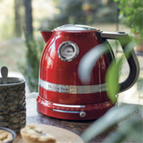 KitchenAid Artisan 5KEK1522 Electric Kettle in red, outdoors