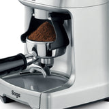 Sage the Dose Control Pro BCG600 Coffee Grinder in Silver, grinding into a portafilter