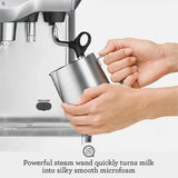 Sage Dual Boiler BES920UK Espresso Machine in Brushed Stainless Steel, frothing milk with the steam wand