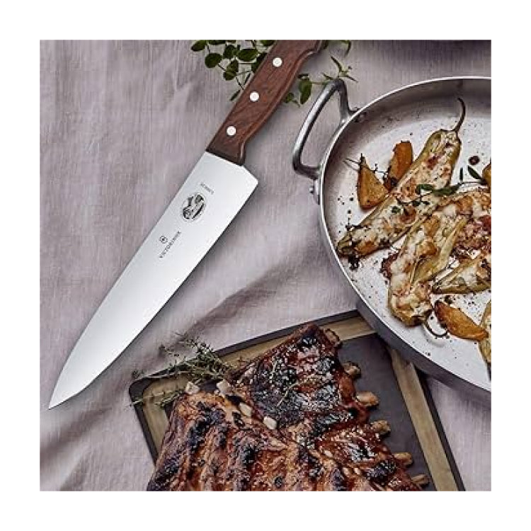 Victorinox Wood 5.2000.25G Carving Knife, with a roast on a board
