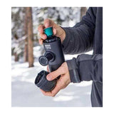 Wacaco Minipresso NS Portable Espresso Maker, held outdoors in the snow
