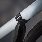 Ass Savers Speed Mullet Regular black front clip-on mudguard mounted on a bicycle downtube.