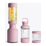 Beast Mighty B85MH Personal Blender in Lilac, base with tall vessel full of fruit beside two smaller vessels