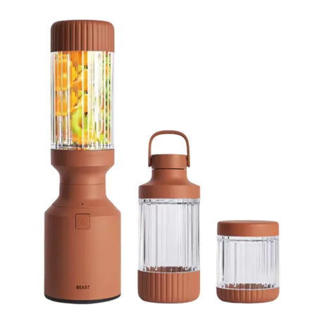 Beast Mighty B85MH Personal Blender in Terra, base with fruit-filled vessel next to carry vessel and small jar