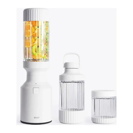 Beast Mighty B85MH Personal Blender in Cloud White, base with fruit-filled vessel next to carry vessel and small jar