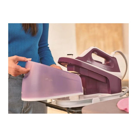 Braun CareStyle 1 Pro IS1514VI Steam Generator Iron in Violet, in use