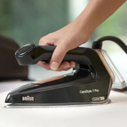 Braun CareStyle 7 Pro IS 7286 BK steam generator iron in black, showing the 2L tank and the FreeGlide 3D EloxalPlus soleplate.