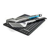 Broil King 60009 in Black, with a spatula and tongs resting on top