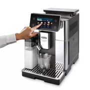 De'Longhi PrimaDonna Aromatic ECAM630.75.TSM automatic coffee machine in titanium silver with a 5-inch touch screen and LatteCrema carafe.