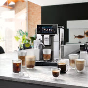 De'Longhi PrimaDonna Aromatic ECAM630.75.TSM automatic coffee machine in titanium silver with a 5-inch touch screen and LatteCrema carafe.