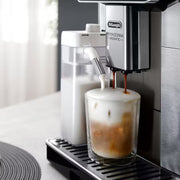 De'Longhi PrimaDonna Aromatic ECAM630.75.TSM automatic coffee machine in titanium silver with a 5-inch touch screen and LatteCrema carafe.