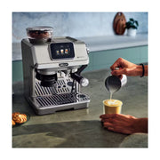 De'Longhi La Specialista Touch EC9455.M manual coffee maker in brushed metal finish showing the 3.5 inch touchscreen and built-in grinder.