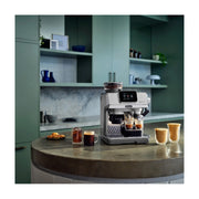 De'Longhi La Specialista Touch EC9455.M manual coffee maker in brushed metal finish showing the 3.5 inch touchscreen and built-in grinder.