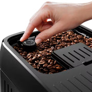 De'Longhi Magnifica Plus ECAM320.70.TB automatic coffee machine in titanium black featuring a 3.5-inch touch screen and milk carafe.