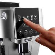 De'Longhi Magnifica Start automatic coffee machine in silver and black featuring one-touch icons and manual steam wand.