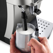 De'Longhi Magnifica Start automatic coffee machine in silver and black featuring one-touch icons and manual steam wand.
