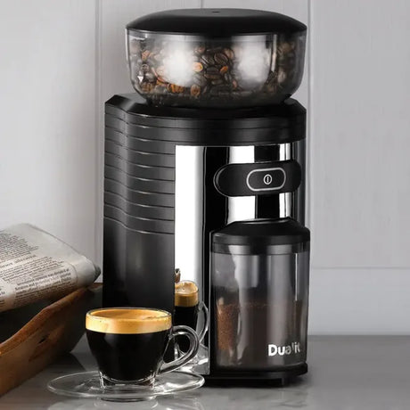 Dualit 75015 in Black, beside a cup of espresso and a newspaper