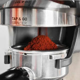 Gastroback 42626, close-up of ground coffee in the portafilter under the grinder