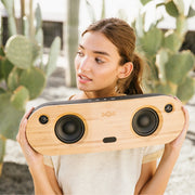 House of Marley Bag of Riddim 2 wireless speaker in its black REWIND fabric carry bag with a solid bamboo faceplate.