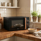 Izzy IZ-8006 Microwave Oven in Black, in a room setting