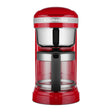 KitchenAid 5KCM1209BER in Empire Red, front view with glass jug and steel filter basket