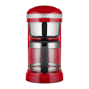 KitchenAid 5KCM1209BER in Empire Red, front view with glass jug and steel filter basket