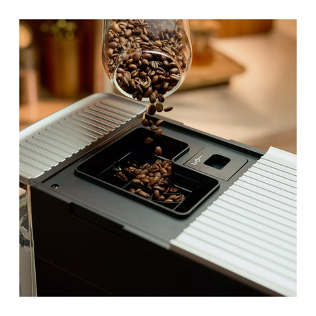 KitchenAid 5KES8453B in Matte Black, coffee beans pouring into the top bean hopper