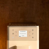 KitchenAid 5KES8453B in Porcelain White, close-up of the touch buttons and cleaning message screen