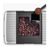 KitchenAid 5KES8454 in Matte Black, top view of the bean hopper full of coffee beans