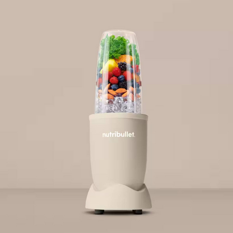 Nutribullet Pro 900 NB907MASN Personal Blender, with a green smoothie
