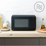 Panasonic NN-K36NBMEPG Microwave Oven in Black, in a room setting