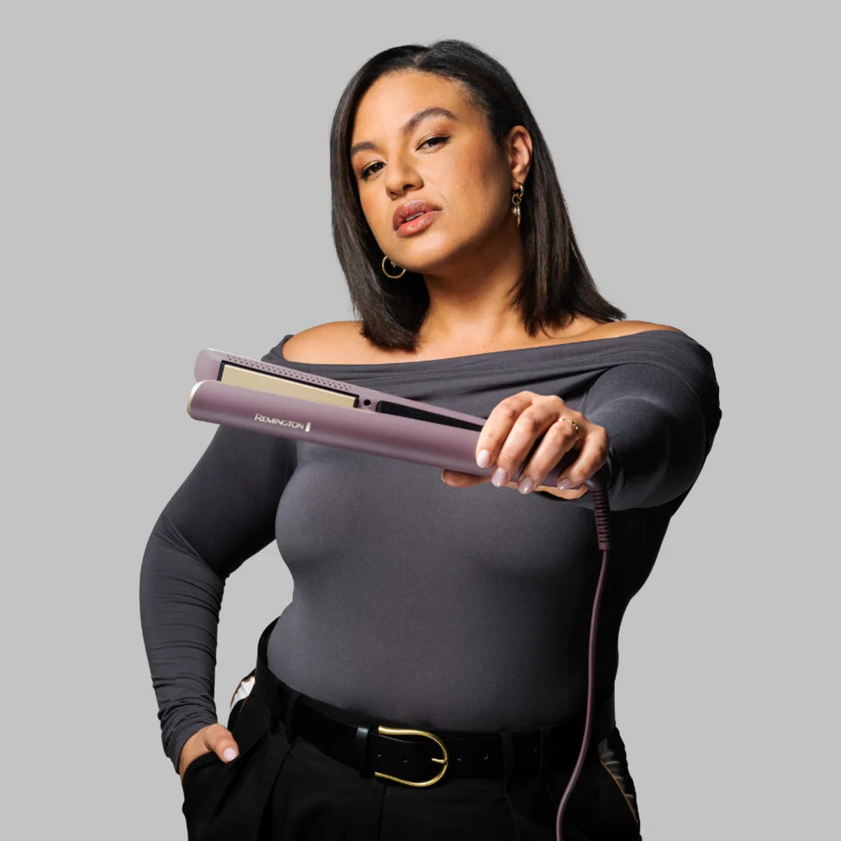 Remington S8930, held out in one hand by a woman