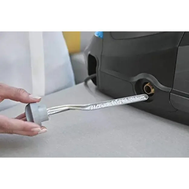 Rowenta DG8622, hands removing the descaling rod with crystals from the base
