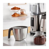 Sage SDC465BSS4GUK1, filter basket with paper filter beside a jar of ground coffee