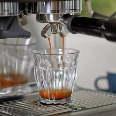 Sage Barista Pro SES878BST Espresso Machine in Black Truffle, close-up of an espresso pouring