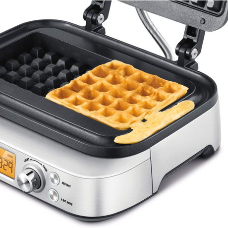Sage Smart Waffle Pro BWM620 Waffle Maker in Brushed Stainless Steel, with a cooked waffle
