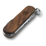 Victorinox Classic SD Wood 0.6221.63 Pocket Knife with walnut scales, closed, angled view with key ring