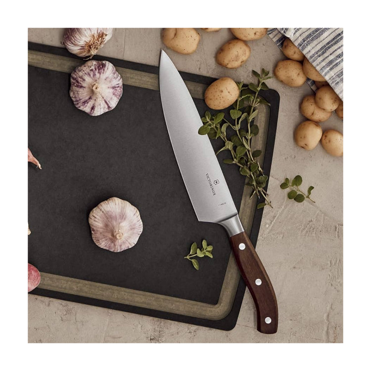 Victorinox Grand Maître 7.7400.20G Chef's Knife, on a chopping board